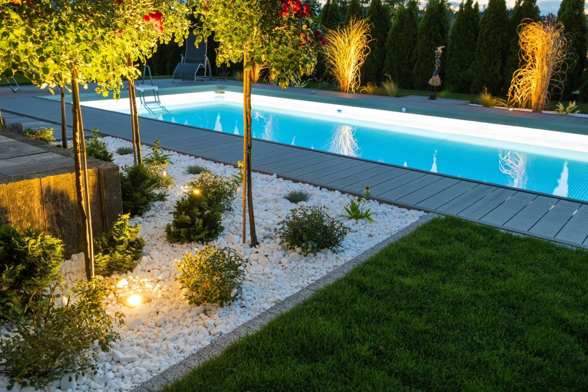Modern pool and poolside landscaping designed and built by Stewart Lawncare & Landscape in Wylie, TX
