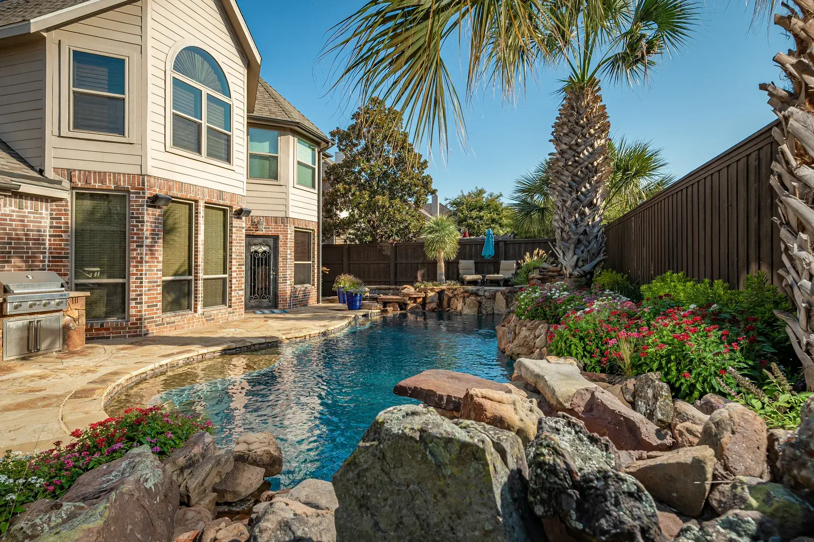 Custom landscape and stonework by Stewart Lawncare at the Stewart family home